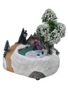 Christmas scenery with bridge and battery-operated skating rink