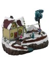 Christmas scene with house and battery-operated skating rink cm