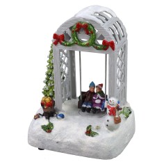 Escenario navideño niños en el columpio funcionando con baterías. 2