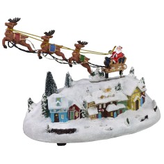 Christmas village with Santa on a working sleigh a