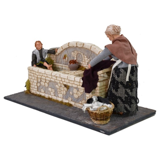 Lavandera de 30 cm con niño con doble movimiento y fuente.