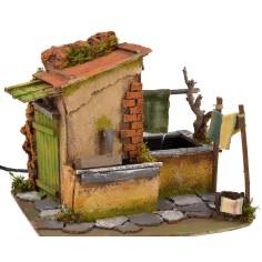 Casa con tendedero goteante y fuente funcionando de 25x21x21,5 2