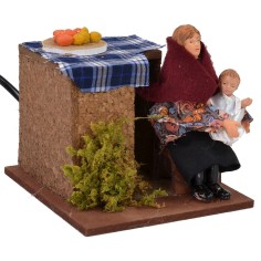 Mujer sentada en movimiento que acuna al niño serie 12 cm Mundo 2