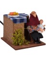 Seated woman in motion cradling the baby 12 cm series