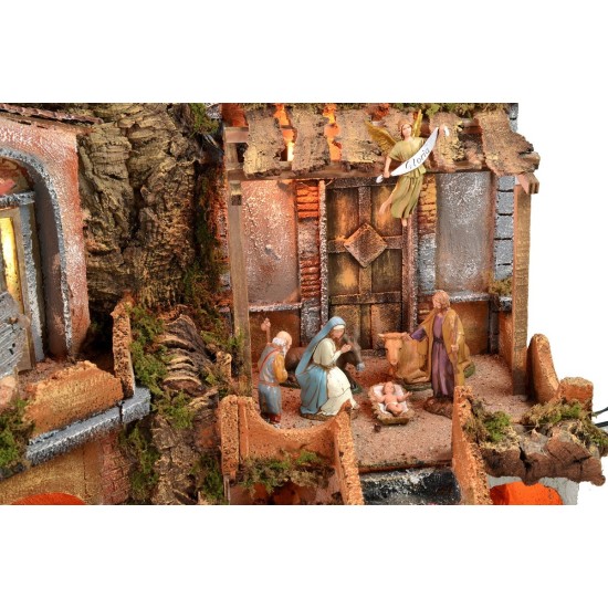 Illuminated nativity scene with functioning waterfall complete with statues