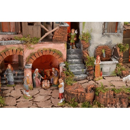 Illuminated nativity scene with functioning fountain complete with statues