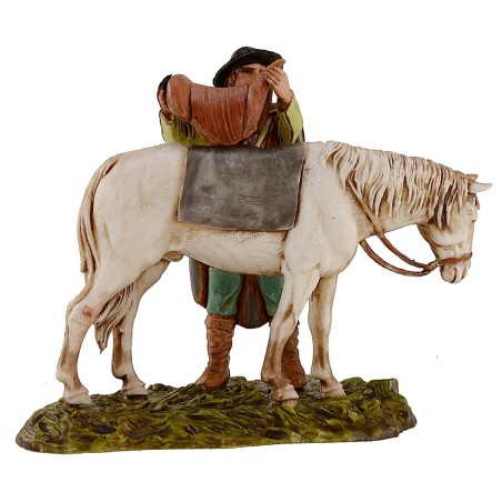 Uomo che sella il cavallo scena 10 cm Landi Moranduzzo