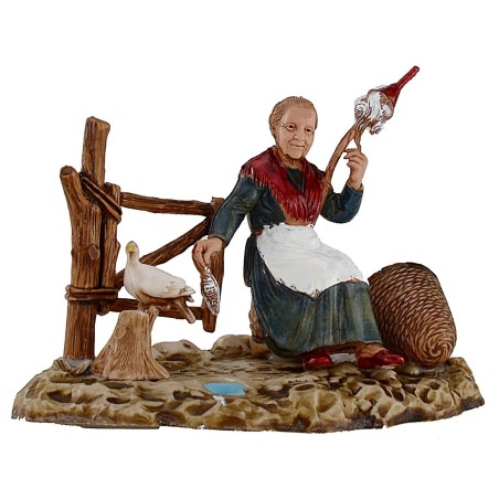 Viejecita que hila con paloma serie 10 cm Landi Moranduzzo