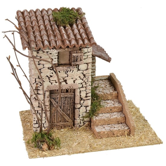 Casita de piedra con escalera lateral de 19x17x18 cm de altura.