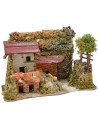 Casa estucada con leñera de 27x12x18 cm de altura.