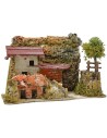 Casa estucada con leñera de 27x12x18 cm de altura.