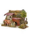 Casa estucada con leñera de 27x12x18 cm de altura.