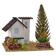 Casas para belén con árbol de 13,5x13,5x9 cm de altura.