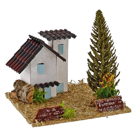 Casas para belén con árbol de 13,5x13,5x9 cm de altura.