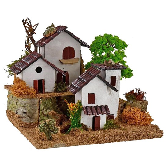 Casitas para belén en dos niveles con árbol de 15x19x14 cm de altura.