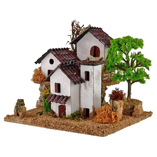 Casitas para belén en dos niveles con árbol de 15x19x14 cm de altura.