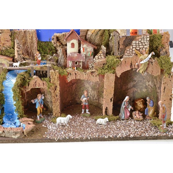 Illuminated nativity scene with a starry sky made of fiber
