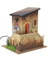 Double movement illuminated house with man ringing the bell and