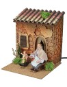 Woman embroidering and child on rocking horse with double