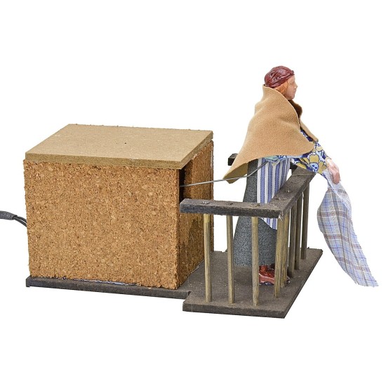 Woman 12 cm on the balcony flapping clothes in motion cm