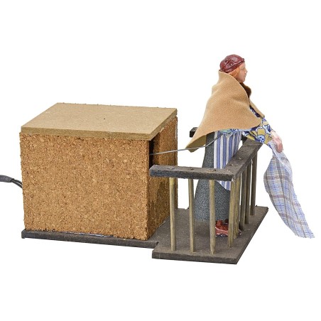 Woman 12 cm on the balcony flapping clothes in motion cm