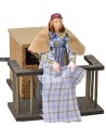 Woman 12 cm on the balcony flapping clothes in movement cm