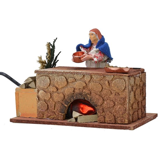 Mujer cocinando en movimiento 16x10x12 h Mundo Pesebre