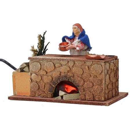 Mujer cocinando en movimiento 16x10x12 h Mundo Pesebre