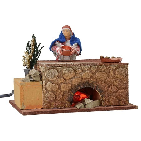 Donna che cucina in movimento 16x10x12 h