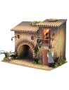 Casa illuminata con lampionaio 12 cm in movimento e donna che