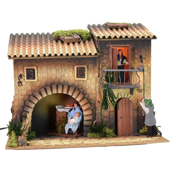 Illuminated house with moving lamplighter 12 cm and woman