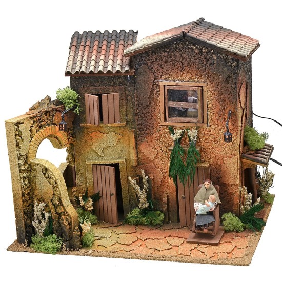 Illuminated village with two women 12 cm in movement cm 45x35x40 h