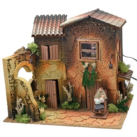 Illuminated village with two women 12 cm in movement cm 45x35x40 h