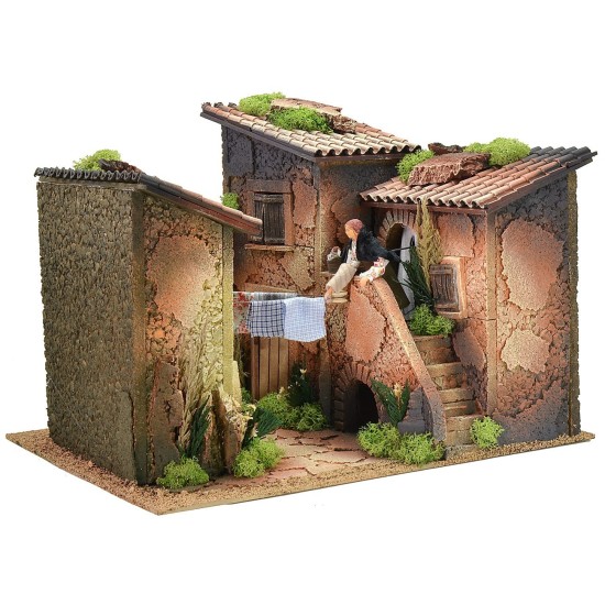 Borgo con donna 12 cm al balcone che stende i panni in