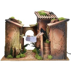 Borgo with woman 12 cm on the balcony hanging out the clothes in