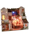 Illuminated Palestinian nativity scene with starry sky, oven and