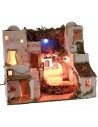 Palestinian Nativity scene illuminated with starry sky and oven cm