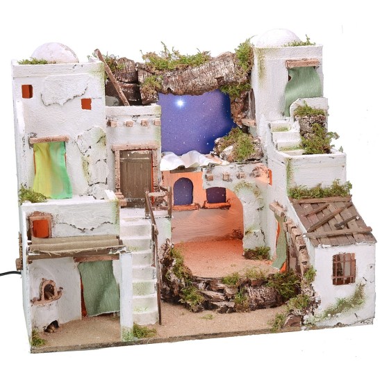 Illuminated Palestinian nativity scene with starry sky and oven