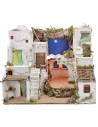 Illuminated Palestinian nativity scene with starry sky and oven