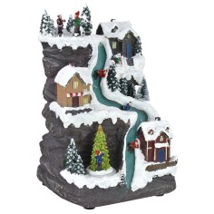 Christmas scenery with illuminated track running on current 2