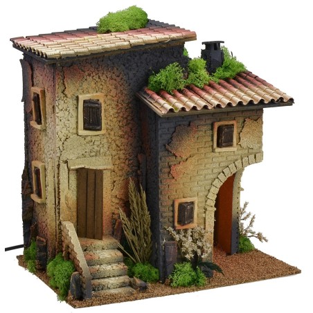 Casa illuminata con grande arco angolare per bottega o grotta