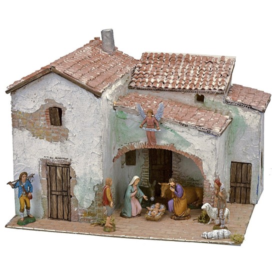 Illuminated stucco village complete with figurines cm 40x30x31 h