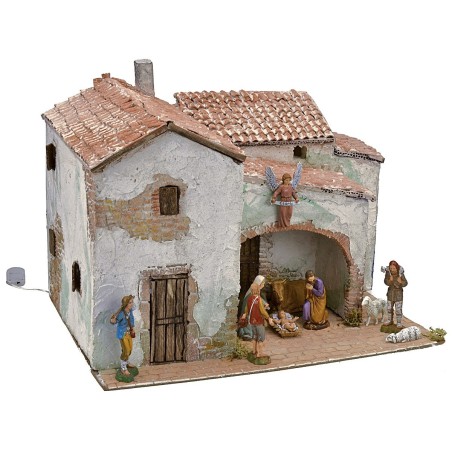 Illuminated stucco village complete with figurines cm 40x30x31 h