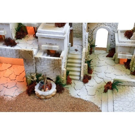 Nacimiento árabe con luces, fuente de doble grifo y fuego.