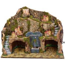 Illuminated nativity scene with working fountain and cave for statues