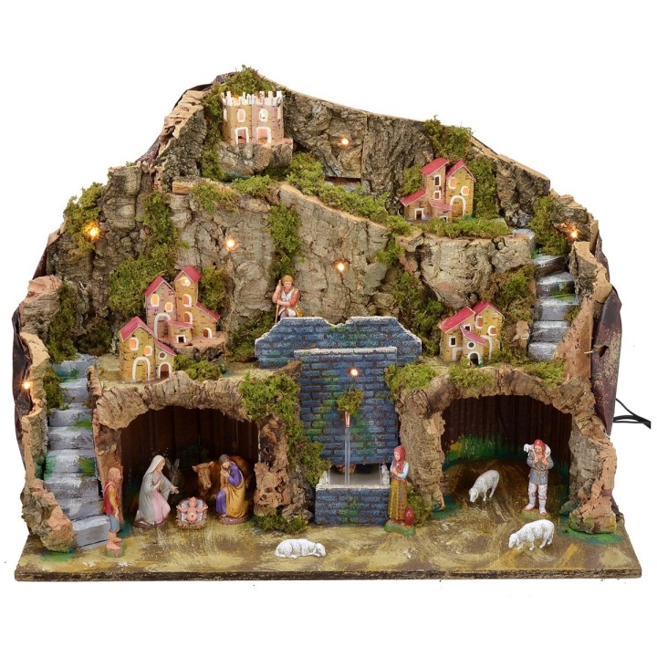Illuminated nativity scene with working fountain and complete grotto