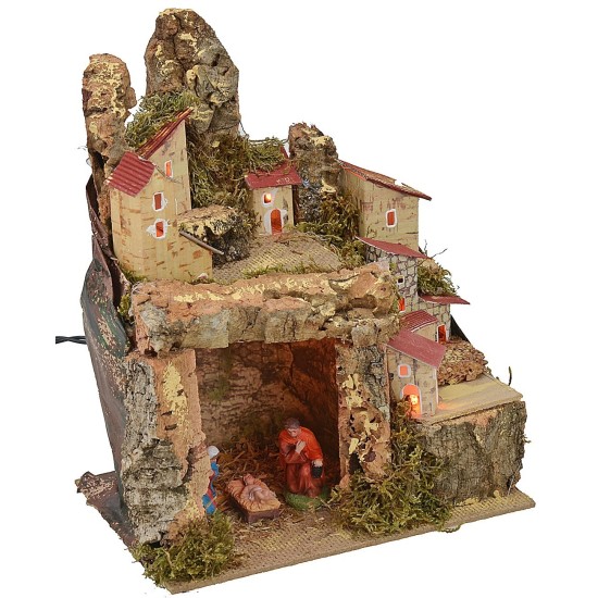 Presepe illuminato con paesaggio e grotta completa di Natività