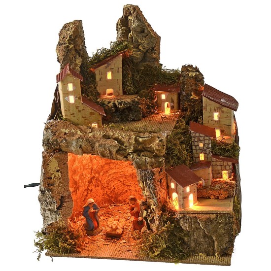 Presepe illuminato con paesaggio e grotta completa di Natività
