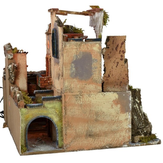 Nativity scene with illuminated village z, working oven and fountain