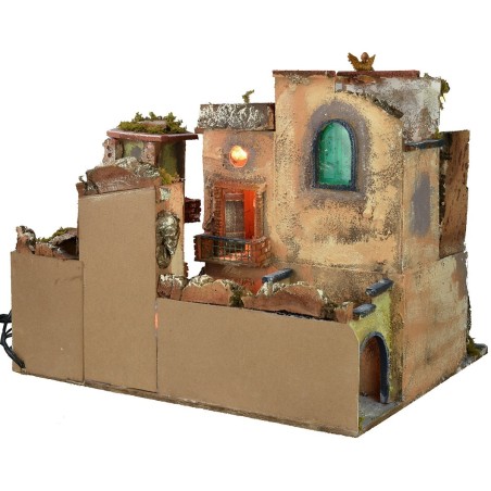 Nativity scene with illuminated village z, working oven and fountain